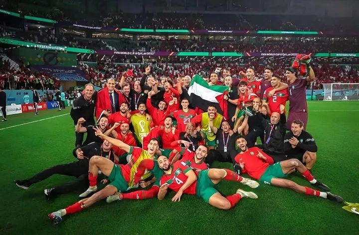 Morocco National Team showing Palestine flag after winning a match